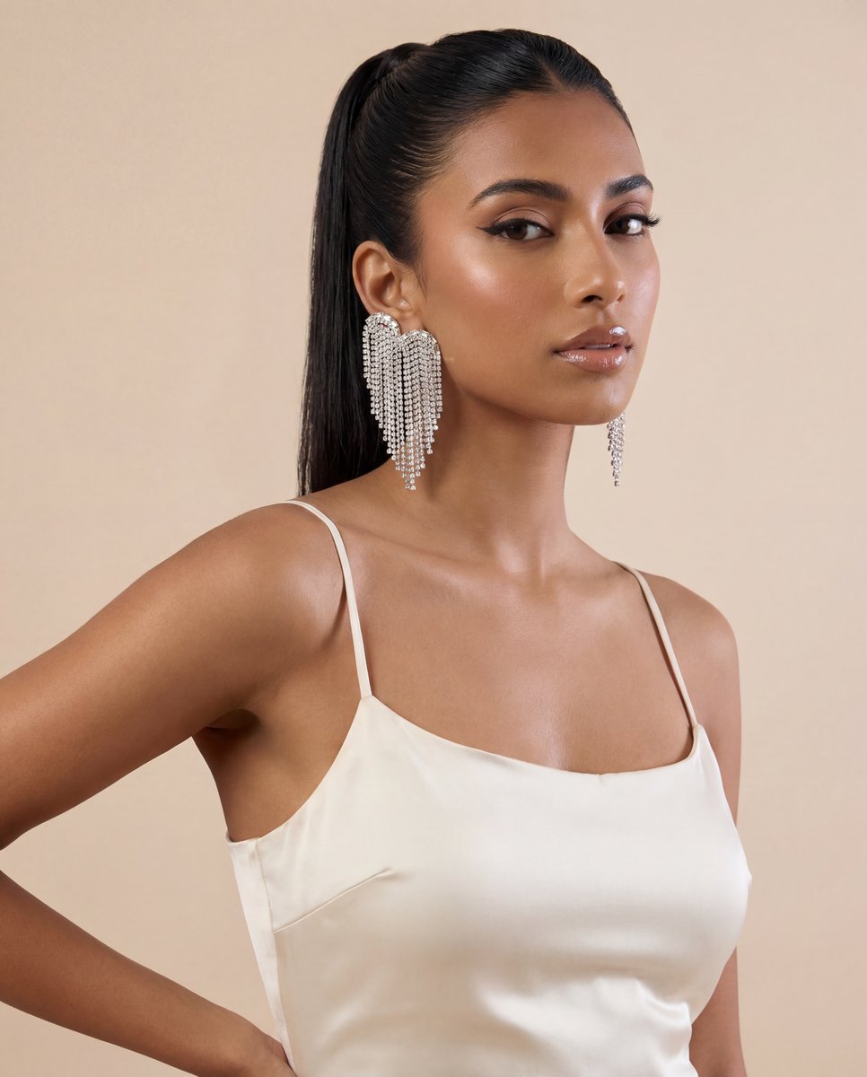 Product Studio PRO — crystal fringe earrings on model in cream satin camisole