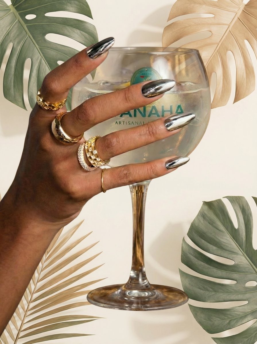 AI product photo — artisanal gin glass held with chrome nails and gold rings